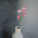 Süße Erbsen aus hellrosa Papier