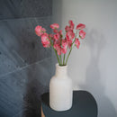 Süße Erbsen aus dunkelrosa Papier