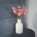 Süße Erbsen aus dunkelrosa Papier