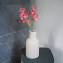 Süße Erbsen aus dunkelrosa Papier