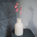 Süße Erbsen aus dunkelrosa Papier